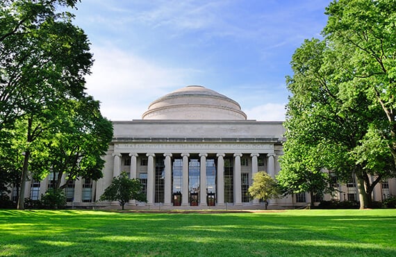 A neoclassical university building with columns and a dome.