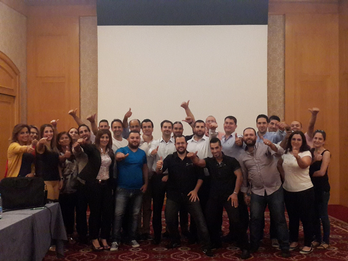 Group of HR professionals celebrating training success.