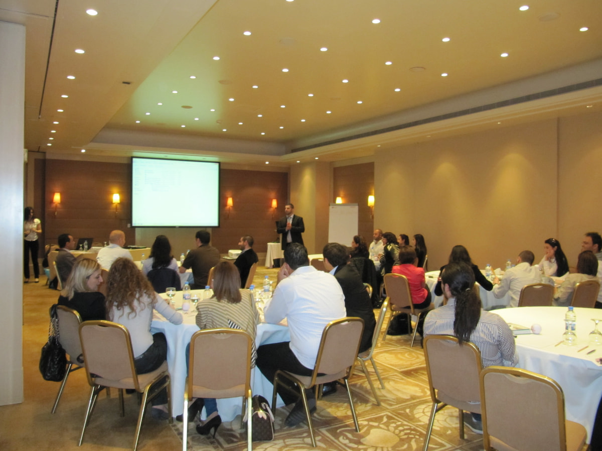 Professional HR workshop with presenter and attendees.